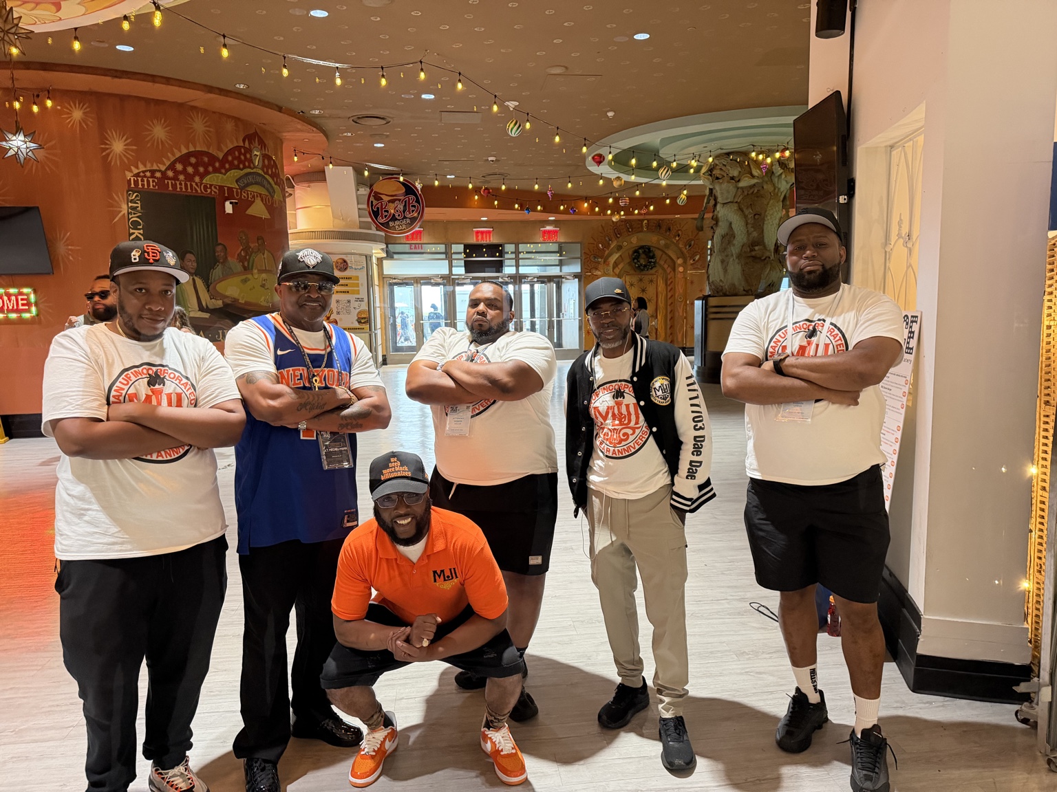 A.T. Mitchell-Mann with his team
